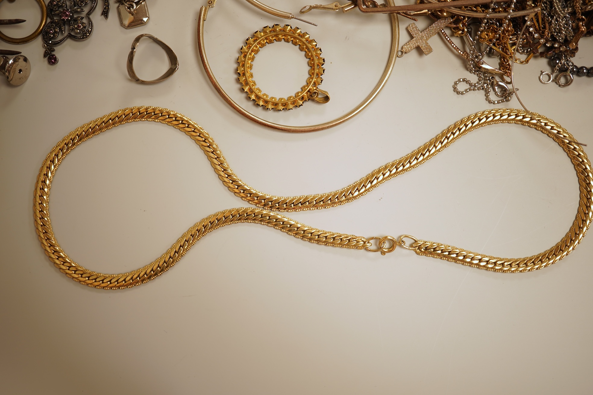 A small collection of assorted costume jewellery and other items including a cut steel shoe buckle, bracelets, chains, pair of silver and enamel oval cufflinks, etc.